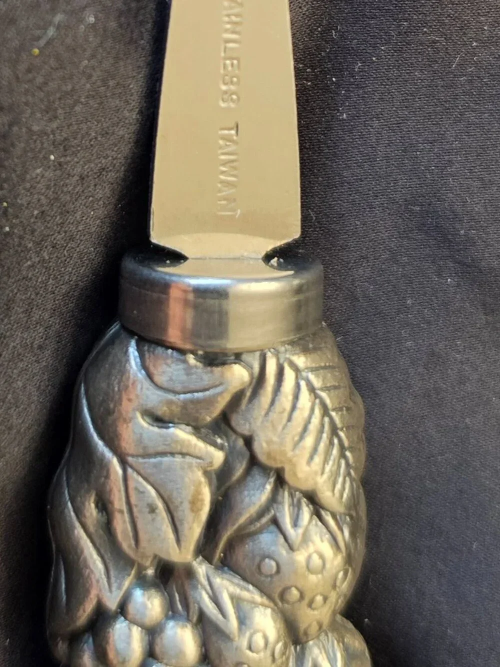 Stainless cheese slicer with fruit/leaf covered nicely weighted handle-kitchen